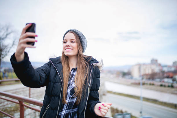 istock Girl looking at phone 678183230