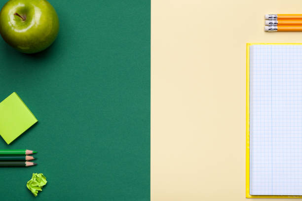 istock School Accessories on Green and Yellow Background 678183774