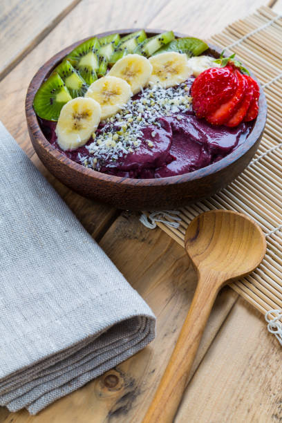 istock Acai bowl on wooden table 678197104