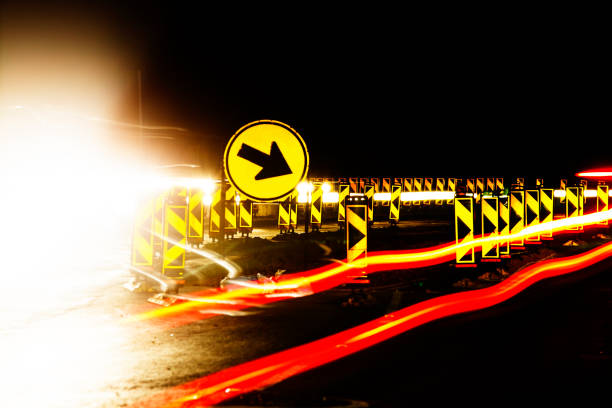 istock Car lights flare at traffic detour road construction 678206512