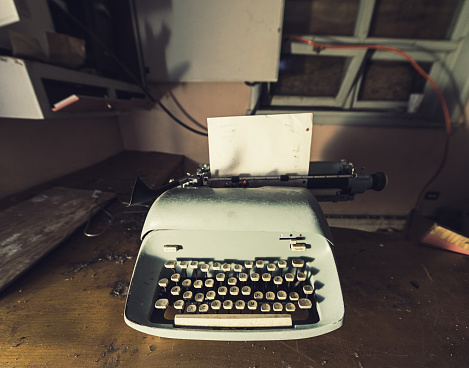 A vintage typewriter inside an abandoned home.