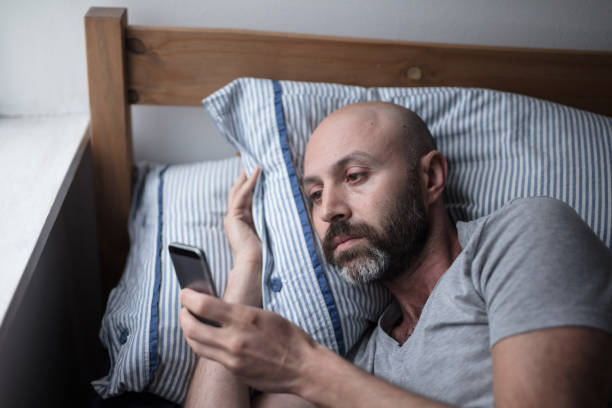 istock Mid forties arabic man in bed suffering with depression 678210848
