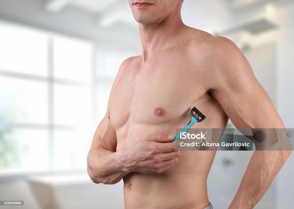 Male Body Hair Removal Attractive Muscular Man Using Razor To Remove Hair  From His Armpit Stock Photo - Download Image Now - iStock