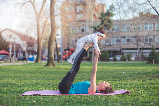 32 years old natural beauty female doing yoga in the local park. She is vital, healthy and well being. Mother of 2 year old baby girl. Loves to exercise whenever she have time. Real people model
