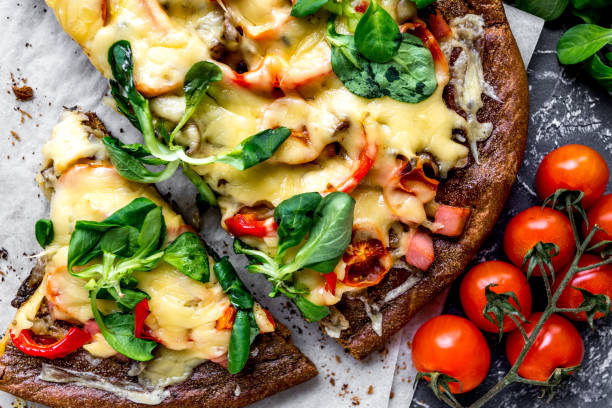 istock cooking pizza with vegetables and cheese on stone desk background top view 678221798