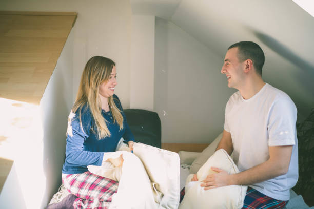 istock Beautiful couple pillow fighting and smiling 678226608