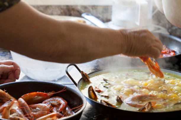 istock Steamy Homemade Paella Traditionally Cooked with Prawns and Shellfish 678239966