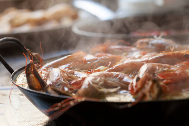 istock Steamy Homemade Paella Traditionally Cooked with Prawns and Shellfish 678240170