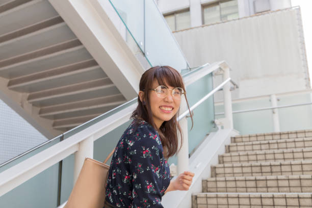 istock Cute woman going up stairs 678243076