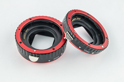 Set of macro rings for SLR cameras on a white background