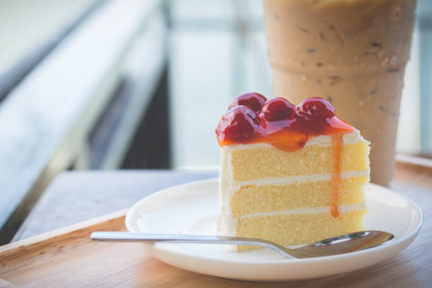 istock Peace of cherry cake serve with iced coffee 678284030