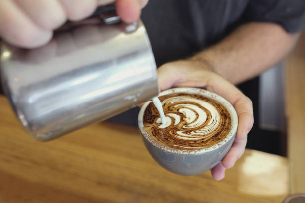 istock barista making coffee cappuccino art 678315640