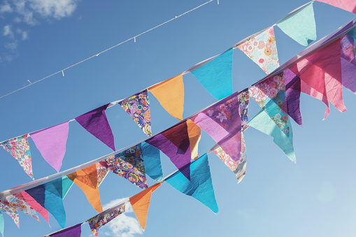 Summer festive colorful bunting and blue sky