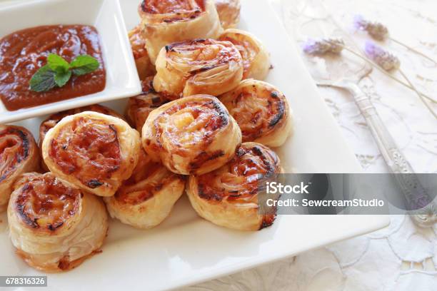 Hawaiian Pizza Rolls On White Serving Plate Stock Photo - Download Image Now - Pizza, Snail, Ham