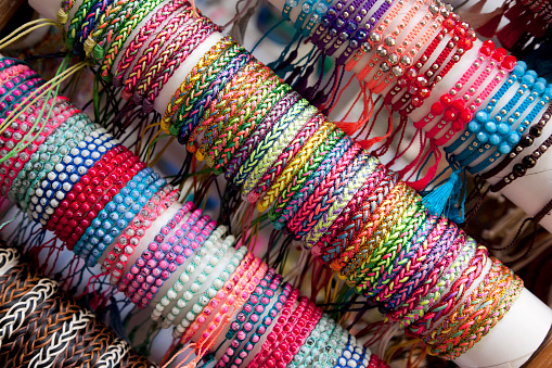 Colorful woven bracelets on sale at the market