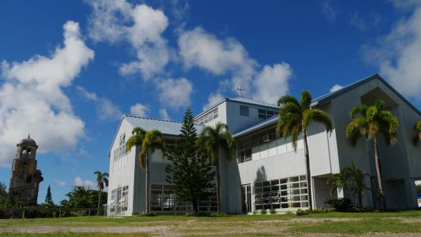 San Jose Catholic church with the remains of the old Bell Tower Church nearby, Tinian, Northern Mariana Islands.