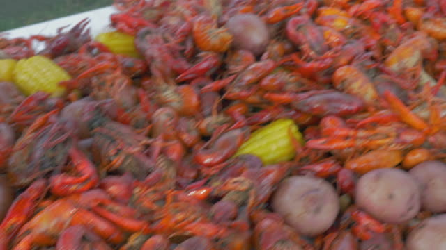 Pan Over a Table Loaded with a Traditional Louisiana Crawfish Boil