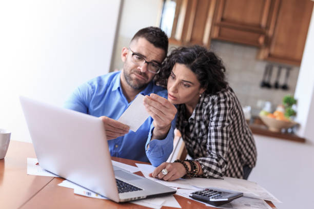 istock Young couple making home budgeting 678413834