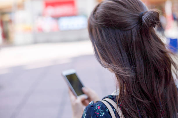 Cute woman walking city smartphone