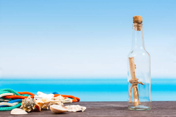 istock Tropical sea seen from the boat. Message in bottle on table 678421694