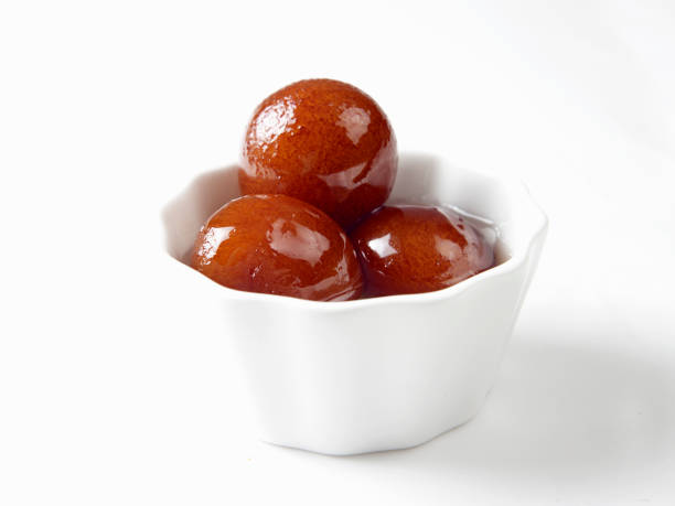 istock gulab jamun served in a white bowl on white background 678433608
