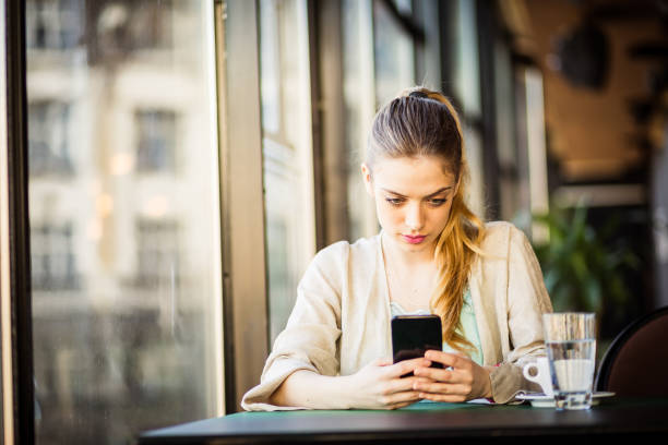 istock Woman drinking coffee texting, taking selfie 678443514