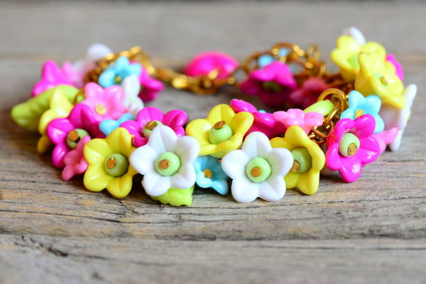 istock Bright bracelet isolated on old wooden background 678444400