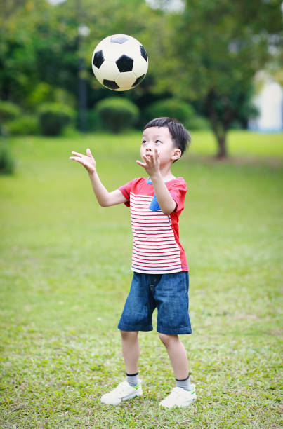 istock Boy with soccer ball 678445066
