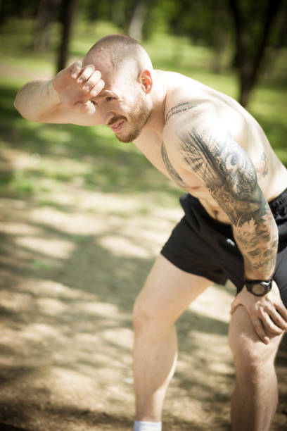 istock Handsome Shirtless Young Man Exercising outdoors. Healthy lifestyle. 678453556