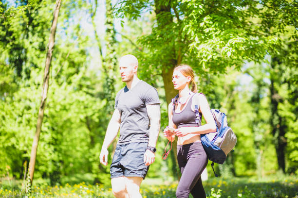 istock Young athlete couple preaparing for outdoors  workout in public park. 678455396
