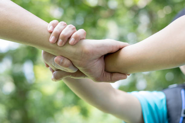 istock Three hands were a collaboration concept of teamwork 678455844