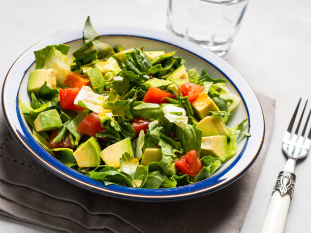 istock Healthy avocado spinach tomato salad 678461200