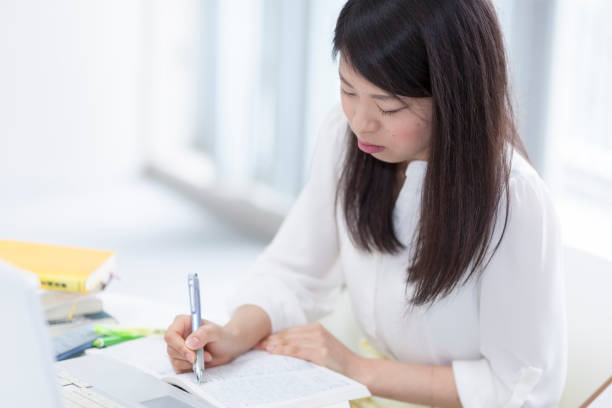 istock Japanese Girl Studying 678462590