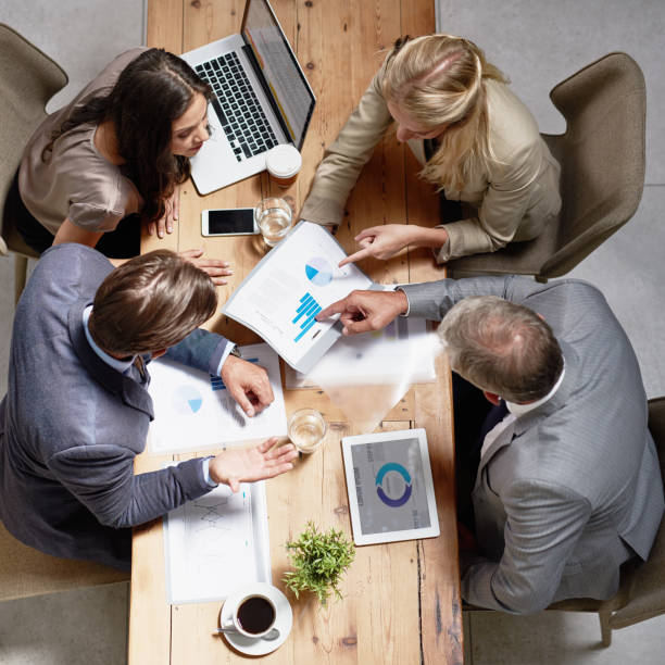 istock Analysing their latest business figures together 678496336