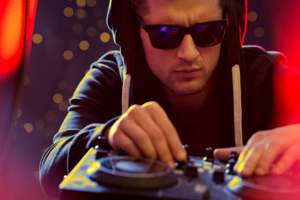 istock Dj mixing music at party 678497254