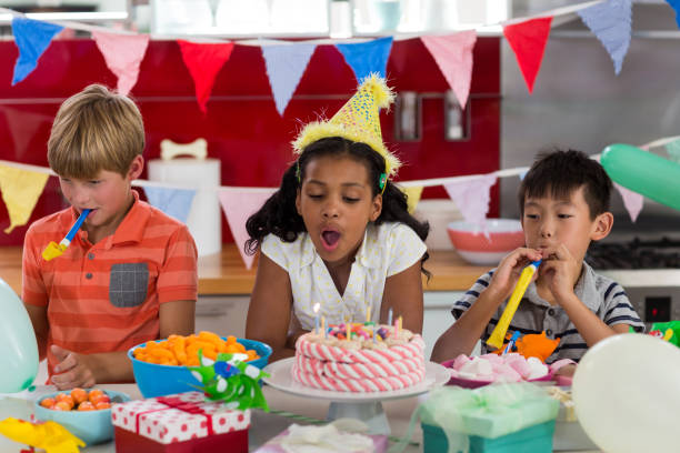 istock Siblings celebrating birthday in kitchen 678497824