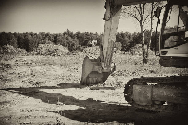 istock Bucket excavator digs, construction site 678500828
