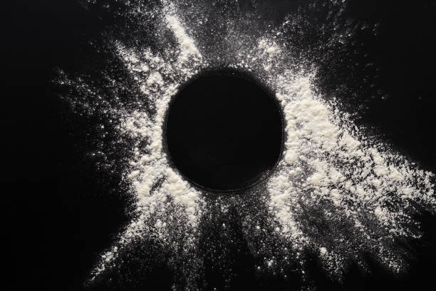 istock Baking concept on black background, sprinkled flour circle with copy space 678502480