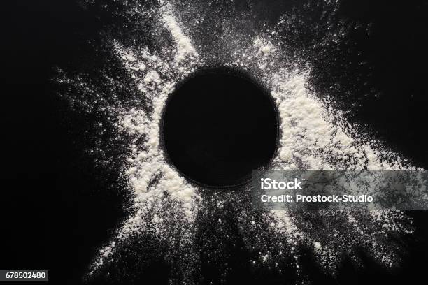 Baking Concept On Black Background Sprinkled Flour Circle With Copy Space Stock Photo - Download Image Now