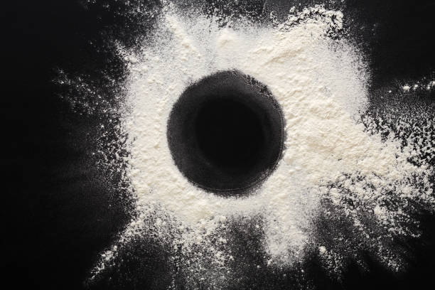 istock Baking concept on black background, sprinkled flour circle with copy space 678502598
