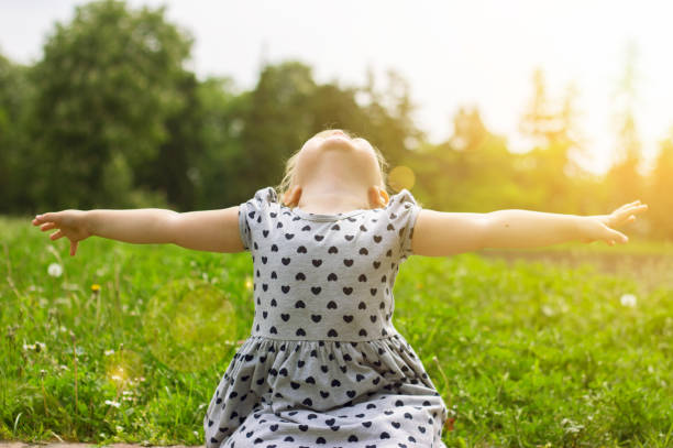 istock Little girl with her arms open, life concept 678507310