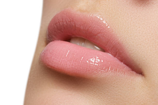 istock Beautiful full pink lips. Lipstick. Professional make-up 678507446