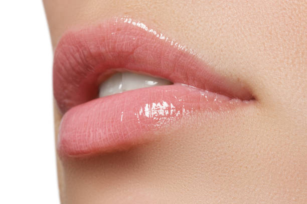 istock Beautiful full pink lips. Lipstick. Professional make-up 678507522