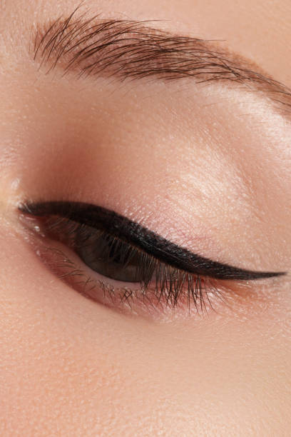 istock Beautiful female eye with sexy black liner make-up 678507588
