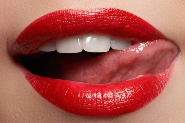 istock Close-up happy female smile with healthy white teeth, bright red lips make-up 678507666