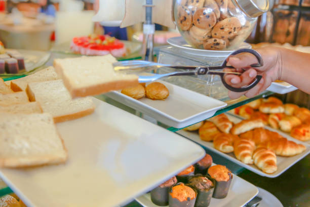istock Adult men hands taking slice of bread in buffet table 678513338