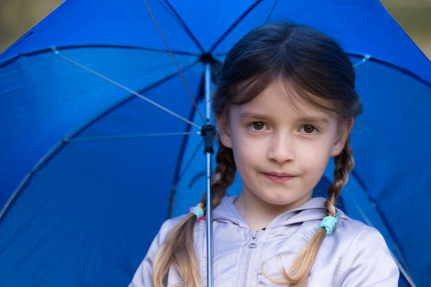 A little girl with an umbrella
