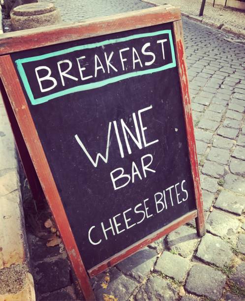 istock Breakfast, Wine bar and snacks sign near sidewalk cafe 678514748