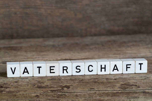 istock German word fatherhood, written in cubes 678526928