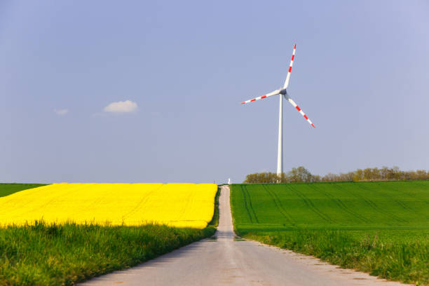 istock Wind farm with spinning wind turbine 678531352